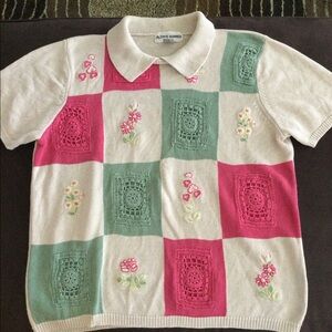 Sweater with crochet design.